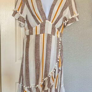 Cute dark brown, gold/yellow with Pom Poms. Never worn.